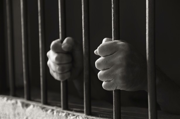 Hands holding the bars